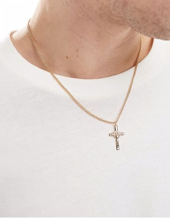 cross pendant with design in gold tone