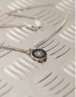 sun engraved pendant necklace in black and silver